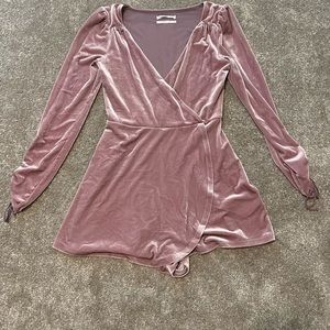 Urban Outfitters pink velvet romper with drawstring adjustable sleeves.